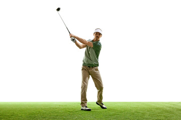 Professional golfer in casual attire in mid-swing with driver on artificial turf against white...