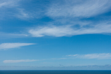 Blue sky with the horizon line and ocean