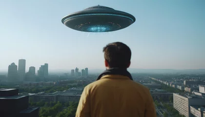 Foto auf Acrylglas alien invasions. World UFO Day. aliens among humans. The arrival of an alien ship to earth. people noticed UFOs in their city. flying saucer in the city © Vladislav