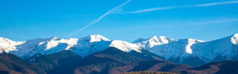 Beautiful landscape with the Fagaras mountains with their peaks covered in snow