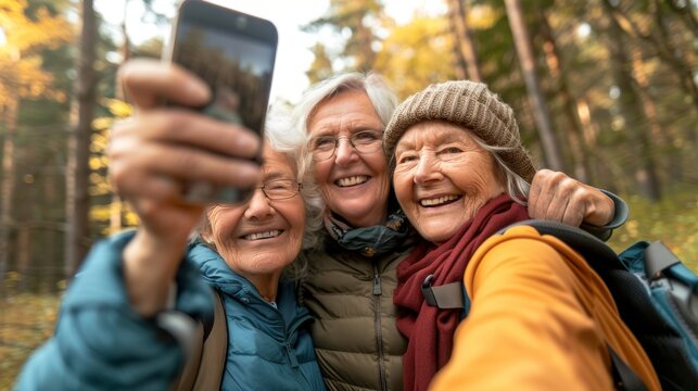 Fitness or selfies of women on social media when exercising outdoors during retirement. Pictures, diversity, or elderly people hiking and taking pictures during a break from training in the park.