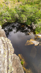 Beautiful and tall waterfall sliding down the rock wall in Serra do Cipó in Minas Gerais, Brazil