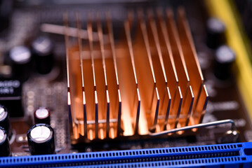 A copper radiator for cooling the chip on the computer board. Radio components.The computer's...