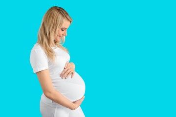 Young happy woman pregnant posing