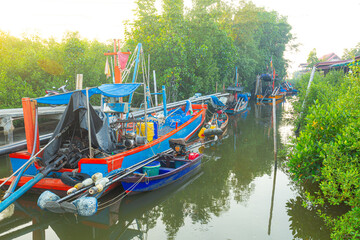Obraz premium Mangrove forests and small fishing boats in Asia