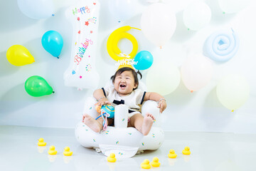 A girl is celebrating her 1st birthday,Indian baby girl celebrate her first birthday.