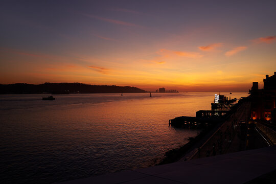 Tagus River promenade at sunset time, Lisbon