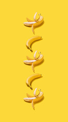 Banner vertical bananas with hard shadows pattern on yellow background