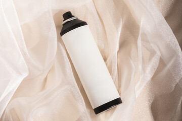 Hair spray bottle with silky tulle background