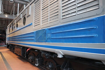 Vintage locomotive retro train. Beautiful locomotive in blue and red colors.