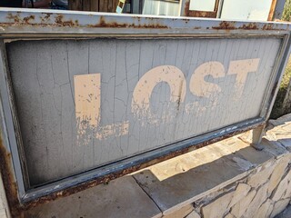 "Lost" signage with rust & weathered patina