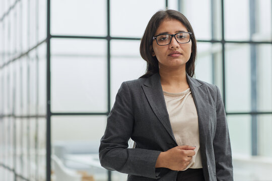 A Woman In Glasses Is Standing With Her Arms Crossed And Looking At The Camera Law Office Portrait Photography Career Coaching