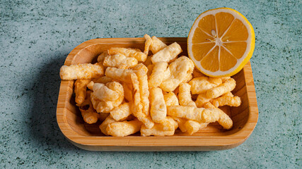 Salty corn sticks on plate