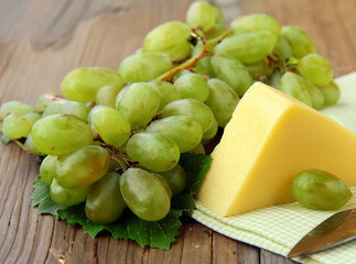 block cheese and fresh green grapes