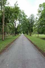 Fototapeta na wymiar Straight road in Si Satchanalai Historical Park