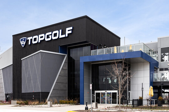 Schaumburg, IL, USA - March 27, 2024: TopGolf features multiple floors of driving range bays and is a fun entertainment complex for all ages to enjoy.
