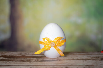 Eggs wrapped in a colorful gift tie. Easter, Pascha or Resurrection Sunday concept