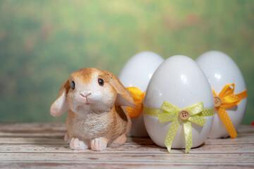 Eggs wrapped in a colorful gift tie with a rabbit. Easter, Pascha or Resurrection Sunday concept