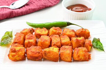 Paneer 65 fried dish served in a plate.