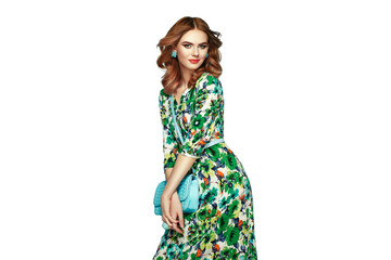 Blonde young woman in floral spring summer dress. Girl posing on a transparent background. Summer floral outfit. Fashion photo. Glamour lady with handbag - 773263129