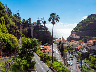 View of the small town of Ponta do Sol on Madeira from the mountain side. - obrazy, fototapety, plakaty