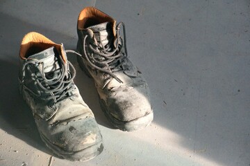pair of old worn work boots