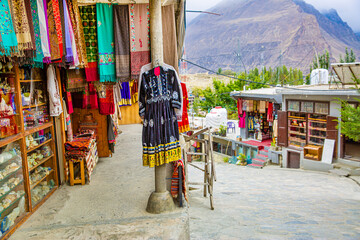 Street with shop with clothes and other souvenirs in Karimabad, Pakistan.