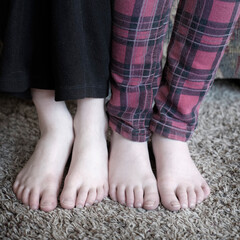Feet of Two Kids in Pajamas