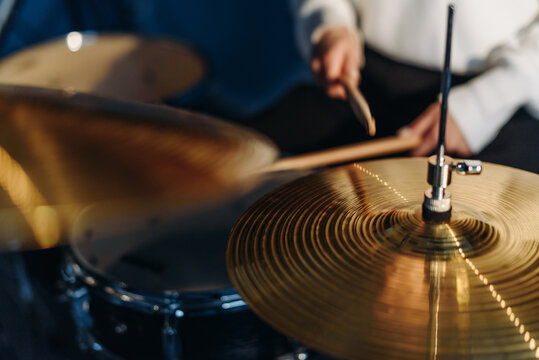 young woman playing drum set