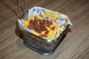 Portion of French Fries with Bacon in Basket