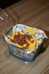Portion of French Fries with Bacon in Basket