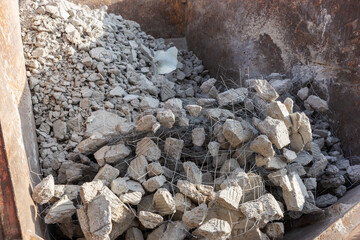 Construction rubble with probation in the construction container - obrazy, fototapety, plakaty