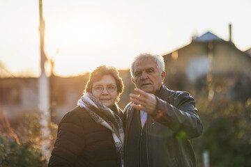 Senior Couple Walking Around The City