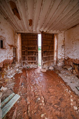 Gate in abandoned adobe house in Carrizosa