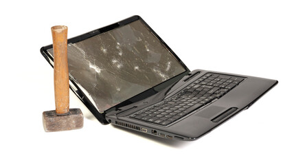 Old broken laptop isolated on white background, broken with hammer