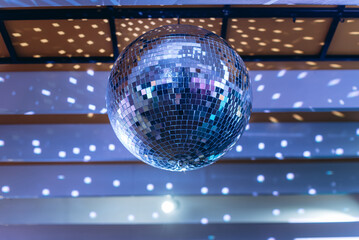 disco ball with bright rays, night party background