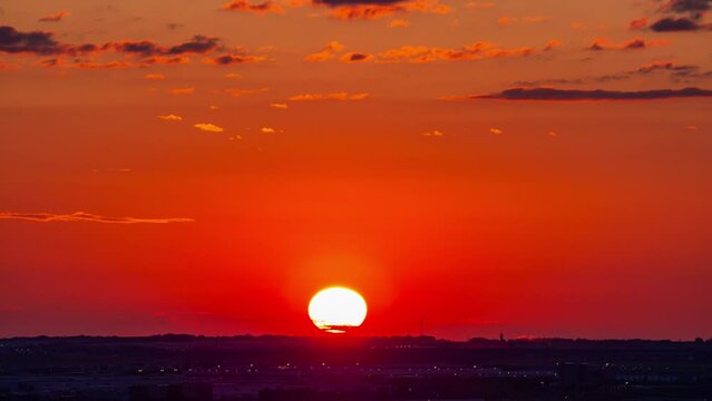 Dramatic sunrise, sunset timelapse 4k footage b-rool of round down at horizontal mountain. sky in the evening glowing red atmosphere. heavenly illustration nature. new hope beginning of life concept