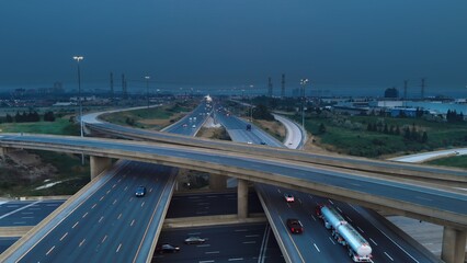 Thunderstorm is getting closer to American city. Top-down footage captures multi-level transport...