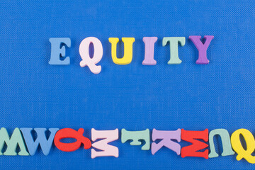 EQUITY word on blue background composed from colorful abc alphabet block wooden letters, copy space...