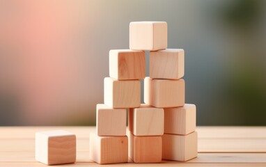 A stack of wooden blocks sitting on top of a wooden table