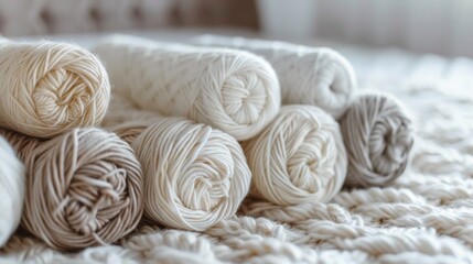 Close-up shot of neatly arranged yarn skeins on a plush mattress, evoking a sense of tranquility and creativity