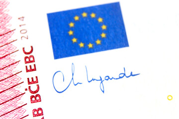 Close-up of a 10 euro banknote fragment with the flag of the European Union and the signature of...