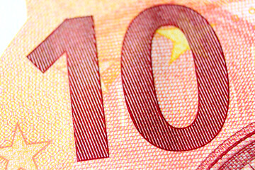 Close-up of a 10 euro banknote fragment on the obverse side, showing the denomination - number 10 . Macro photography. - obrazy, fototapety, plakaty