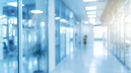 Fototapeta premium Blurred background of a light modern office interior with windows and beautiful lighting.