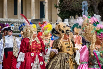 Foto auf Acrylglas Colorful carnival masks and costumes at a traditional festival in Corfu,Greece © ernestos
