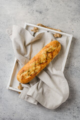 garlic baguette on a gray background