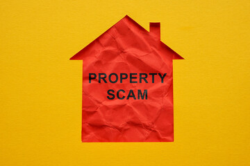 Property scam concept. Outline of a house cut out in paper.