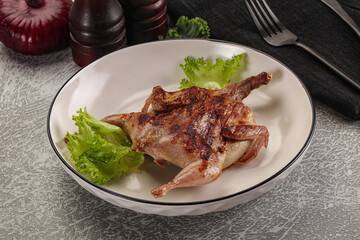 Grilled quail in the plate
