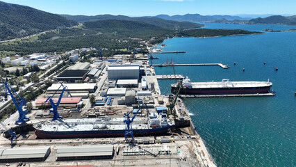 Aerial drone photo of port town and recently renovated ship yard of Skaramagas in Western area of Attica, Elefsina bay, Attica, Greece