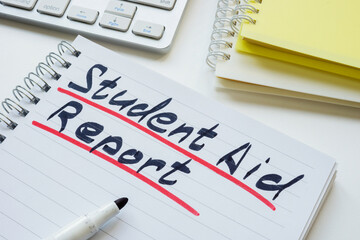 Student aid report. Handwritten note in a notebook.